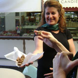 Tour guide offering samples of artisan English Toffee