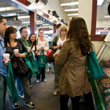Tour guide extolling virtues of butcher at Farmers Market