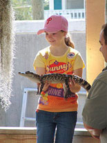 Child Holding Alligator
