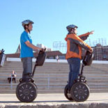 Gliding near Ghirardelli Square while exploring Fisherman's Wharf on a guided Segway Tour