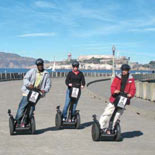Riding i2 Segways on the Municipal Pier at the Aquatic Park - Alcatraz is in the background